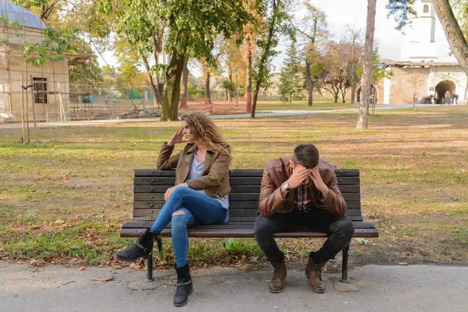 Couple on a bench talking