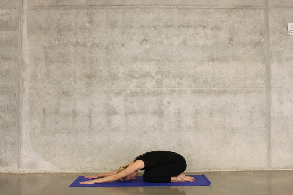 woman doing child's pose