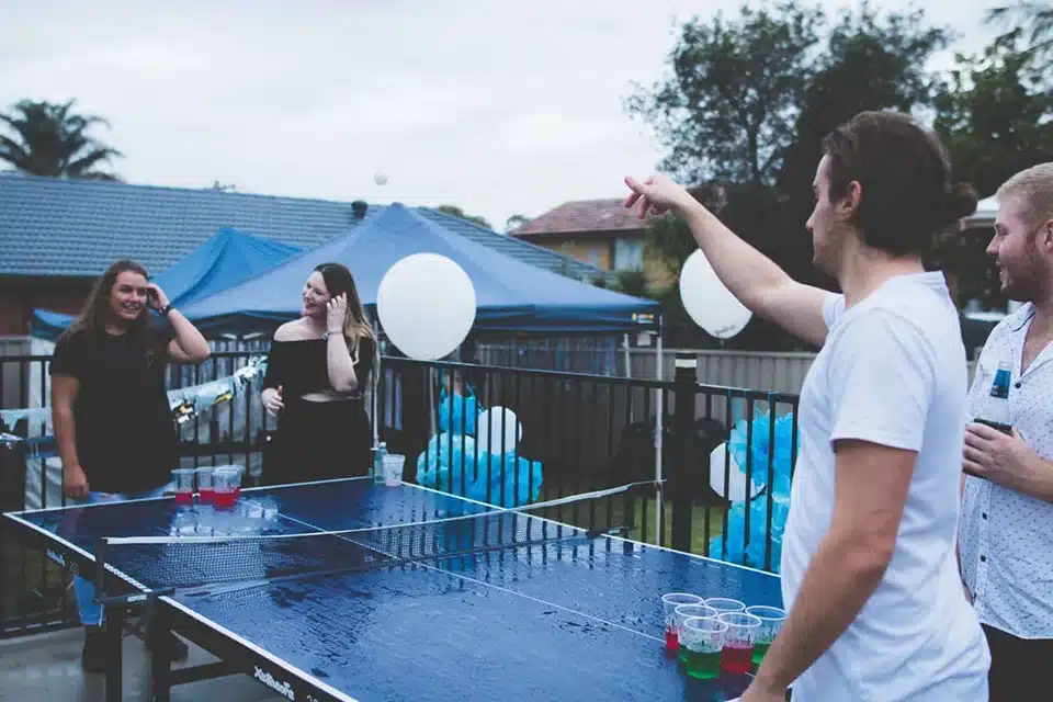 People playing beer pong