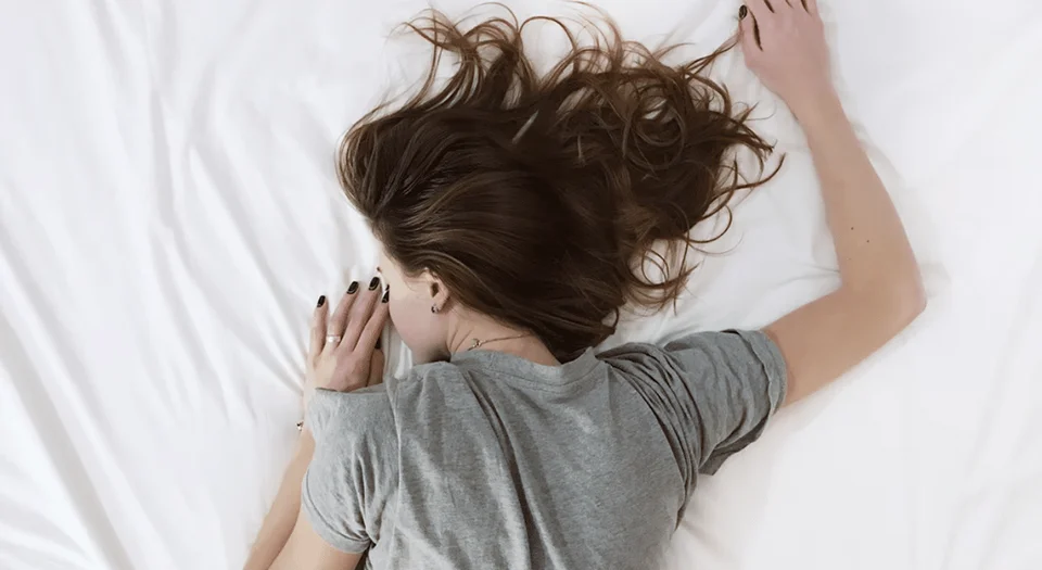 Woman lying on a bed