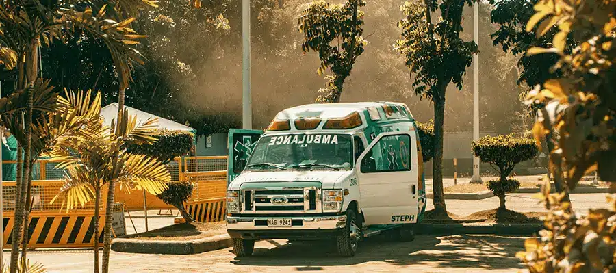 CIWA Protocol with ambulance- he image is meant to represent the CIWA Protocol, which is a medical assessment tool used to measure the severity of alcohol withdrawal symptoms. The ambulance in the background is meant to represent the need for medical attention in severe cases of alcohol withdrawal.