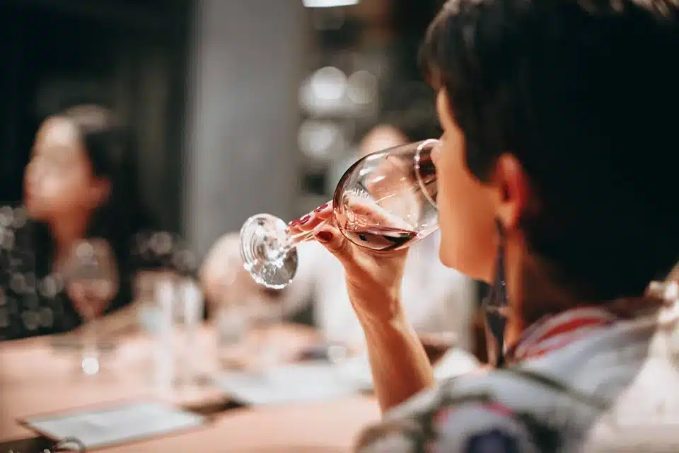 Woman drinking a glass of wine