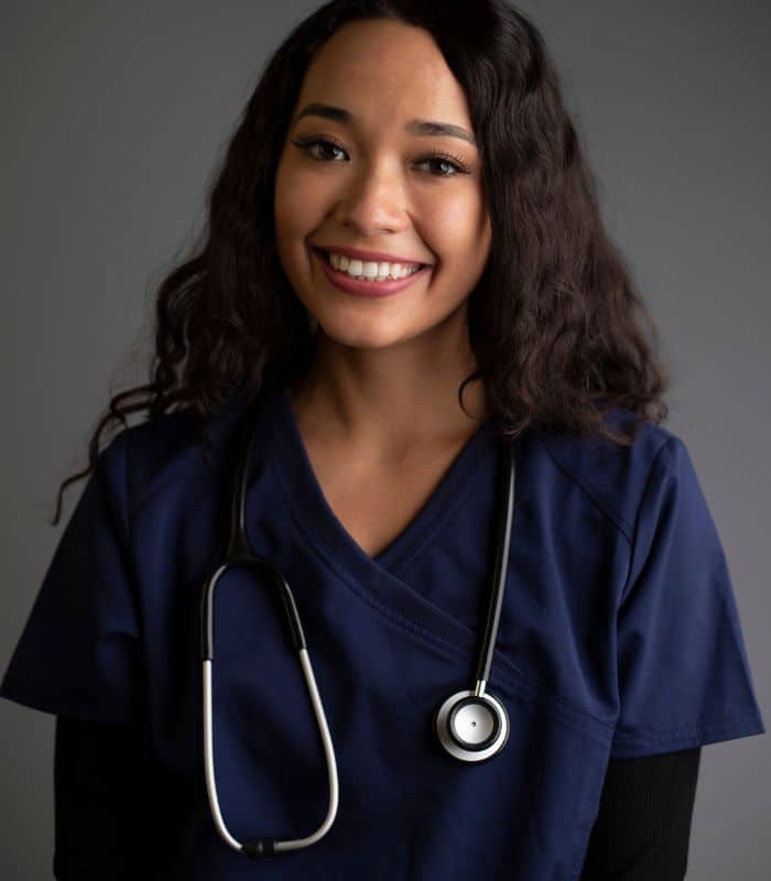 A photo of a staff member at Opus Health, a drug addiction treatment center in Orange County. The staff member looks educated and experienced.