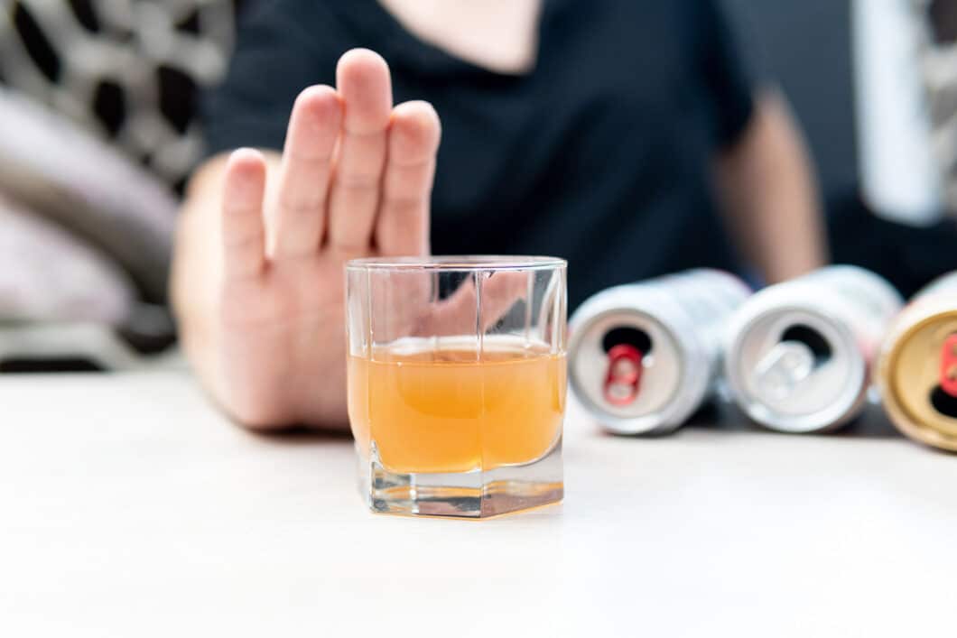 Alcohol Withdrawal - Man Holding Hand Up to Alcohol