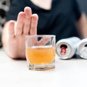 Alcohol Withdrawal - Man Holding Hand Up to Alcohol
