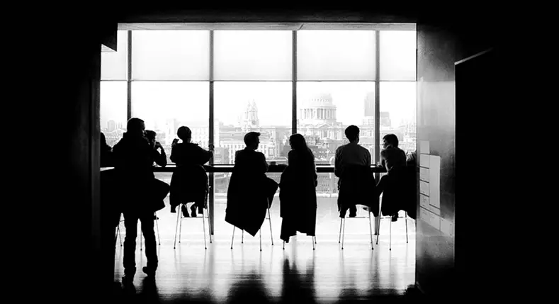 Silhouettes of a team meeting 