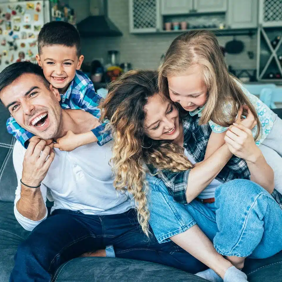 Happy Family jumping on each other