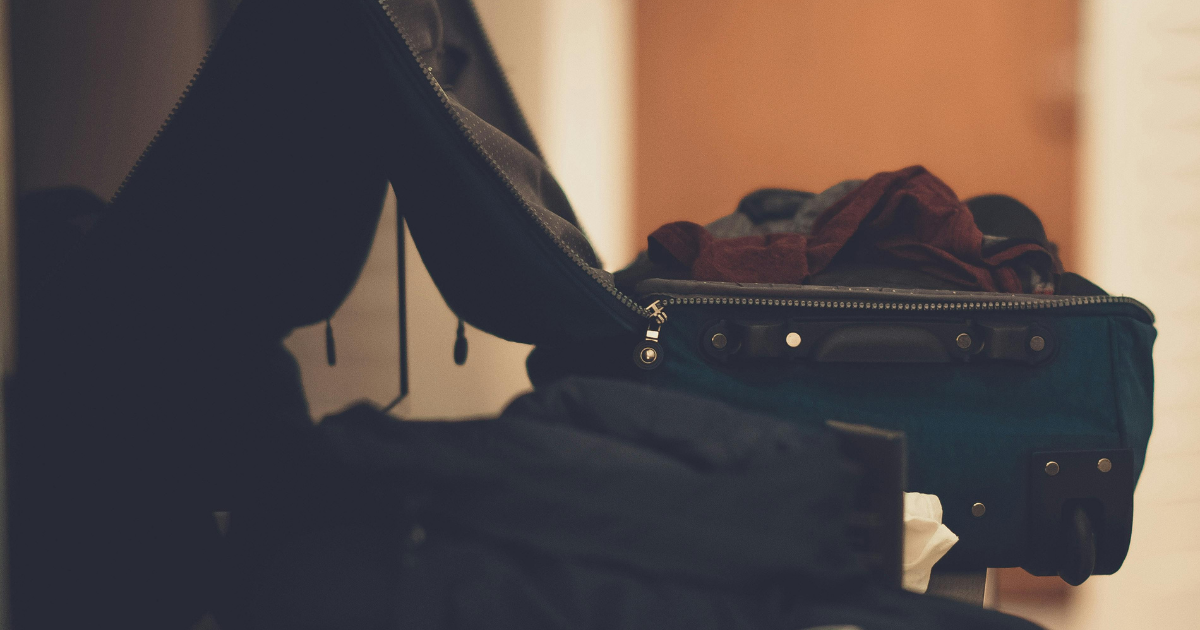 Rehab packing list: An open suitcase with clothes, essential items for a comfortable recovery. Travel light for rehab.