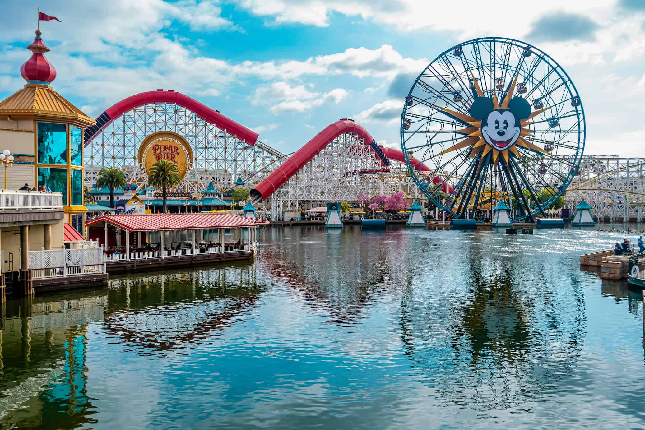 Disneyland in Anaheim, CA as seen from across the theme park's water feature.
