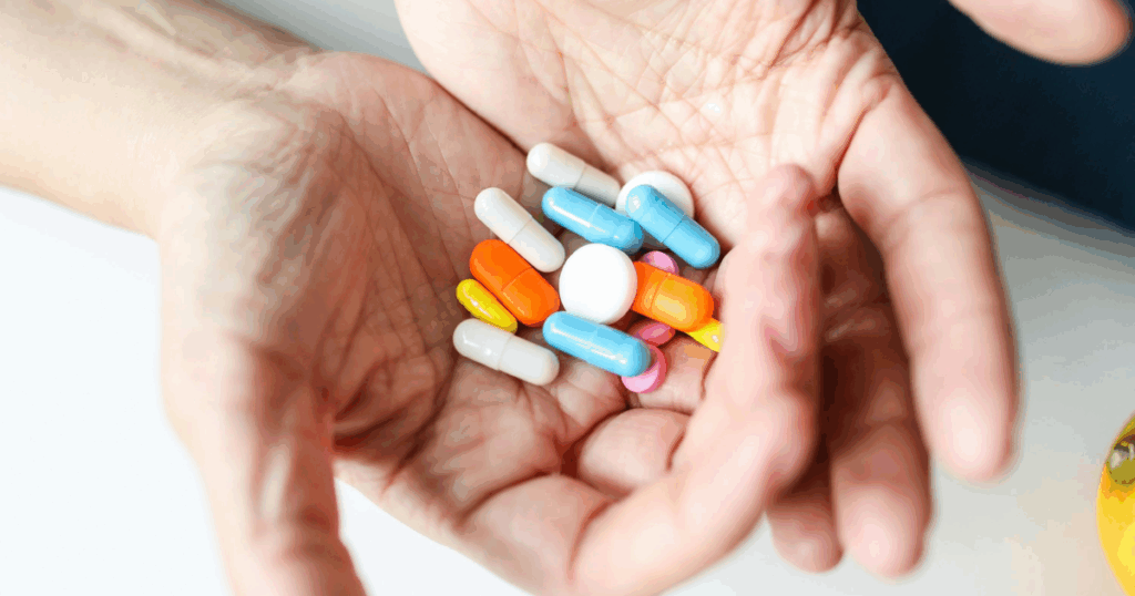 Klonopin withdrawal: a handful of colorful pills representing medication management for easing Klonopin withdrawal symptoms.