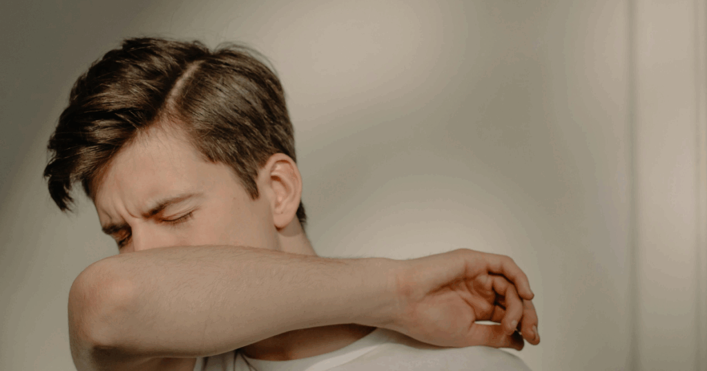 Lamictal withdrawal symptoms: Man experiencing discomfort, possibly related to medication side effects or withdrawal process.