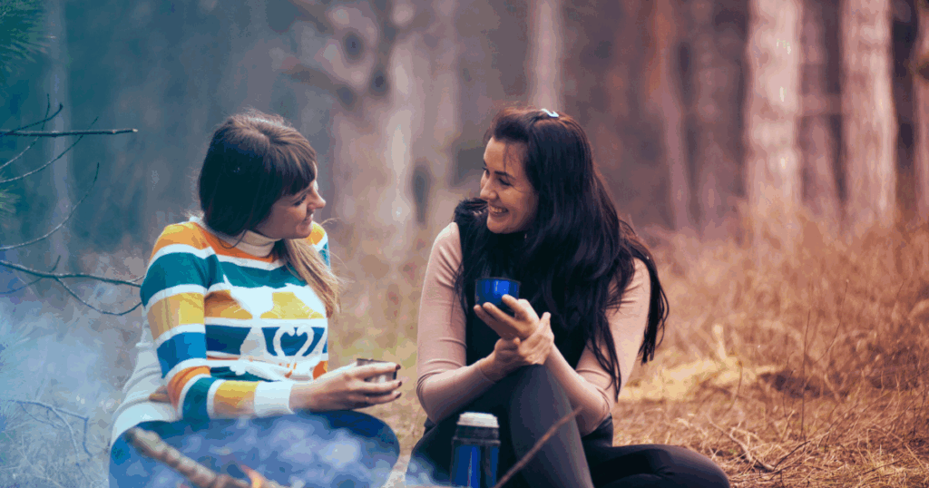 Bupropion withdrawal support: Two women sharing tea outdoors, managing the transition with a friend.