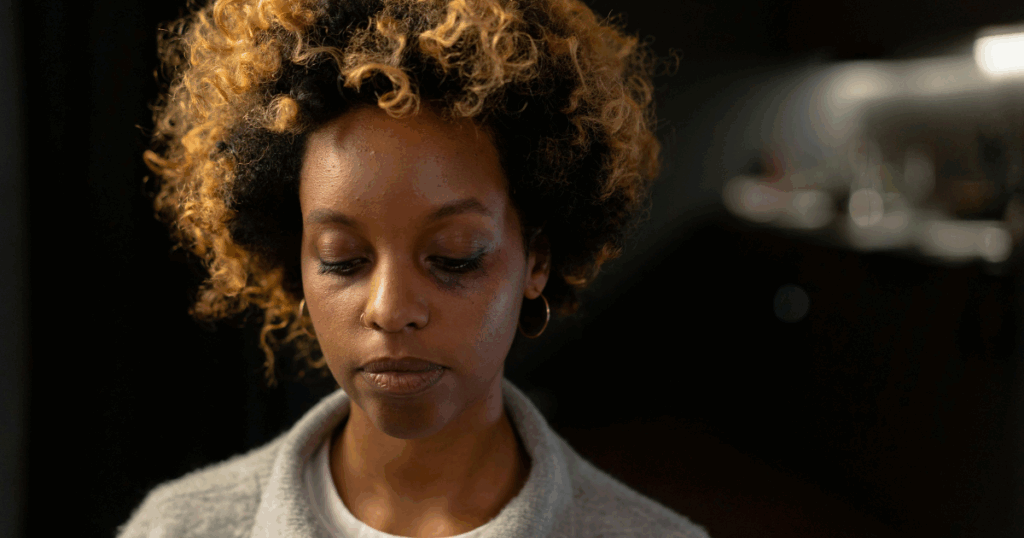 Sad woman experiencing Lexapro withdrawal symptoms, navigating the emotional landscape with difficulty and feeling down.