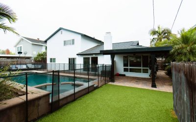 Cari House facilities tour: View of backyard with pool, patio, and artificial turf. Modern home design and outdoor living.